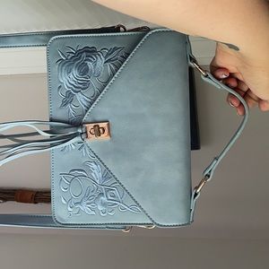 Light blue vegan leather hand bag.